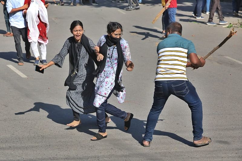 Two female students are being beaten up by the Bangladesh Chhatra League man on the Dhaka University campus