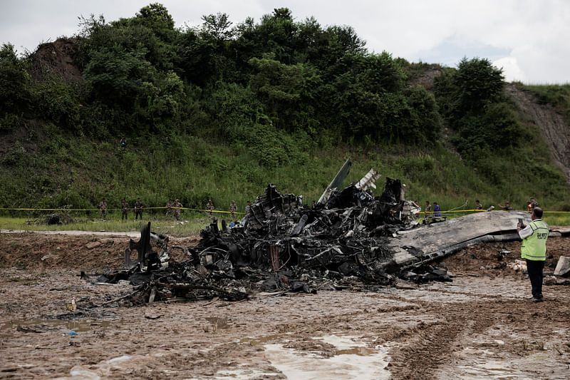 The accident site of a Saurya Airlines plane that caught fire after skidding off the runway while taking off is cordoned at Tribhuvan International Airport, in Kathmandu, Nepal on 24 July 2024.