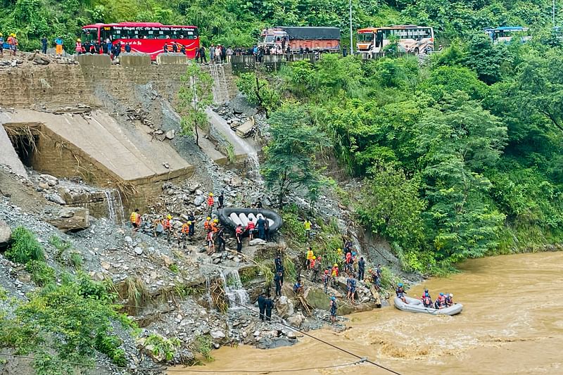 Rescuers search for survivors in river Trishuli in Simaltar, Nepal  on 12 July 2024, at the site of a landslide.