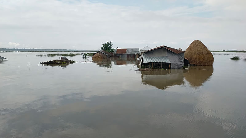 Flooded houses are seen at Algar Char area under Jatrapur union in Kurigram Sadar. Water levels rises in the rivers of the district, flooding vast areas. This picture was taken recently