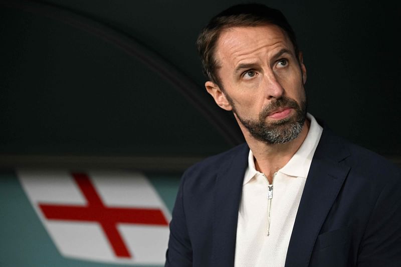 England's coach Gareth Southgate looks on ahead of during the Qatar 2022 World Cup Group B football match between Wales and England at the Ahmad Bin Ali Stadium in Al-Rayyan, west of Doha on 29 November, 2022. Gareth Southgate said he is resigning as England manager on 16 July, 2024 two days after they lost to Spain in the Euro 2024 final. "It's time for change, and for a new chapter. Sunday's final in Berlin against Spain was my final game as England manager," he said in statement.