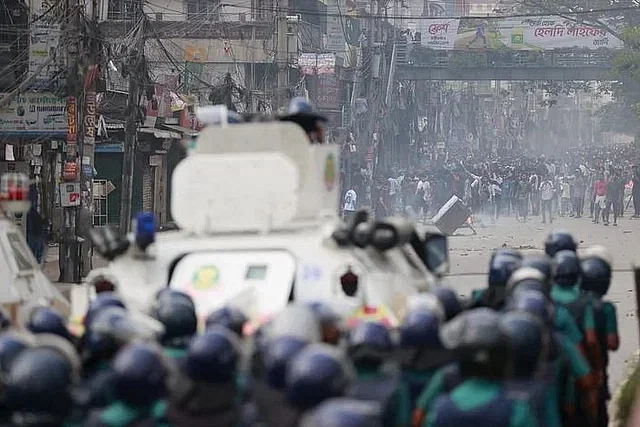 Police take up position with armoured vehicle at Khilgaon in face of demonstrators. 18 July