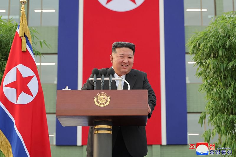 This picture taken on August 15, 2024 and released from North Korea's official Korean Central News Agency (KCNA) via KNS on 16 August, 2024 shows North Korea's leader Kim Jong Un welcoming victims of the flood-affected areas in the northwestern part of the country after they arrived in Pyongyang