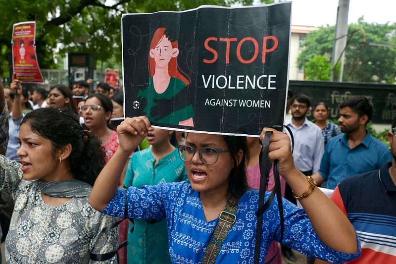 Medical students shout slogans and hold posters as they protest the rape and murder of a young medic from Kolkata, at the Gandhi Hospital in Varanasi on 14 August, 2024