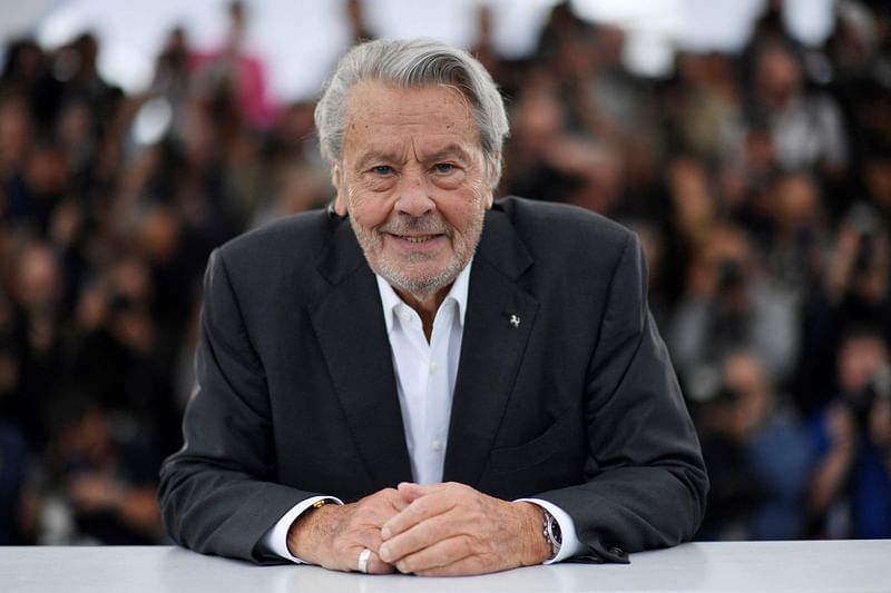 French actor Alain Delon poses during a photocall before being awarded with an Honorary Palme d'Or at the 72nd edition of the Cannes Film Festival in Cannes, southern France, on 19 May, 2019.