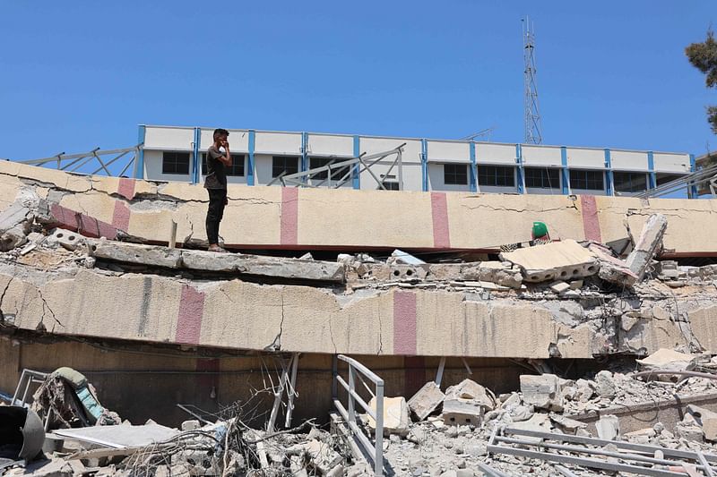 A man inspects the damage after an Israeli strike on a school, housing displaced Palestinians, in the Rimal neighbourhood of central Gaza City on August 20, 2024, amid the ongoing conflict between Israel and the militant Hamas group.