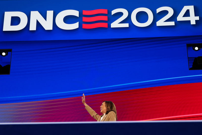 Democratic presidential candidate and U.S. Vice President Kamala Harris waves from the stage during Day 1 of the Democratic National Convention (DNC) at the United Center, in Chicago, Illinois, US, 19 August 2024. `