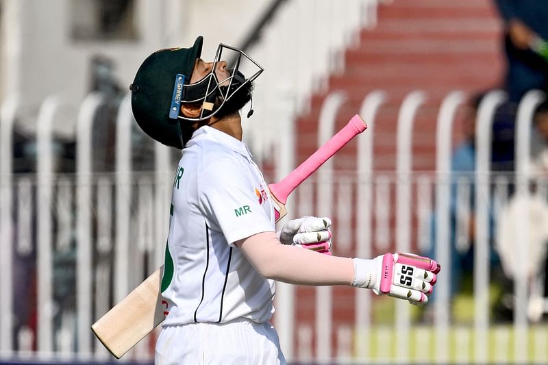 Mushfiqur Rahim reacts as he walks back to the pavilion after his dismissal during the fourth day of the first Test cricket match with Pakistan at the Rawalpindi Cricket Stadium in Rawalpindi on 24 August, 2024.