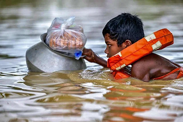 The child was returning to shelter after collecting dry foods in Feni on 24 August, 2024.