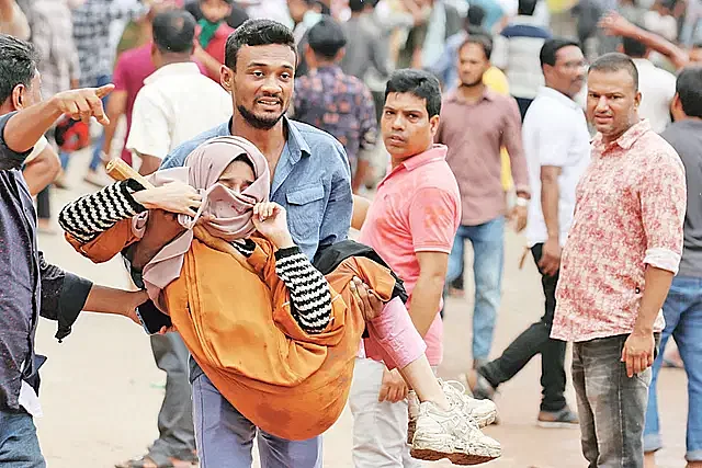 A young student injured in the Students against Discrimination movement being carried to safety, 3 August, Cumilla Police Lines area