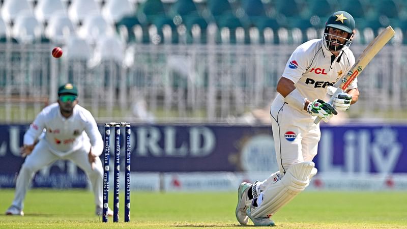 Pakistan's captain Shan Masood plays a shot during the second day of second and last cricket Test match between Pakistan and Bangladesh, at the Rawalpindi Cricket Stadium in Rawalpindi on 31 August, 2024