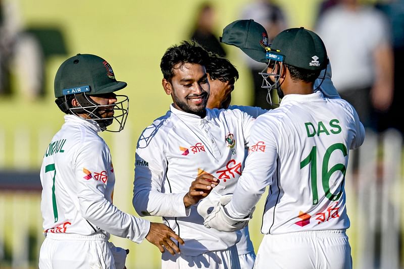 Bangladesh's Mehidy Hasan Miraz (C) celebrates with teammates after taking five wickets during the second day of the second and last Test cricket match between Pakistan and Bangladesh, at the Rawalpindi Cricket Stadium in Rawalpindi on 31 August, 2024.