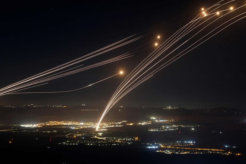 Rockets fired from southern Lebanon are intercepted by Israel's Iron Dome air defence system over the Upper Galilee region in northern Israel, on 4 August, 2024.