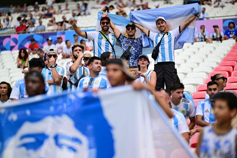 Argentine football supporters cheer ahead of the men's group B football match between Ukraine and Argentina during the Paris 2024 Olympic Games at the Lyon Stadium in Lyon on 30 July, 2024