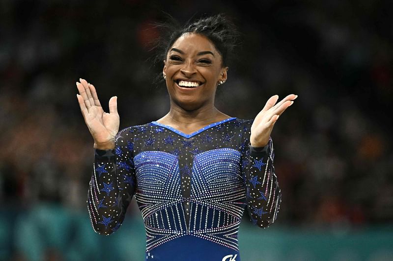 US' Simone Biles reacts after competing in the balance beam event of the artistic gymnastics women's all around final during the Paris 2024 Olympic Games at the Bercy Arena in Paris, on 1 August, 2024.