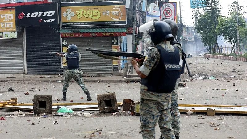 The law enforcement members are firing bullets at Satmatha intersection in Bogura on 4 August 2024