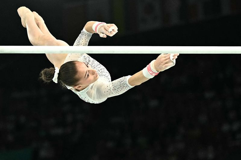 Algeria's Kaylia Nemour competes in the artistic gymnastics women's uneven bars final during the Paris 2024 Olympic Games at the Bercy Arena in Paris, on August 4, 2024