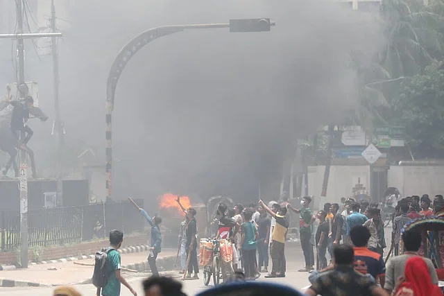 Protestors set fire to a police box at Shahbagh