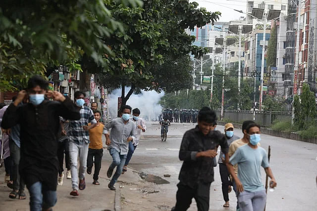 The police fire tear gas shells and sound grenades to disperse the protesting students at Uttara in Dhaka on 2 August, 2024.