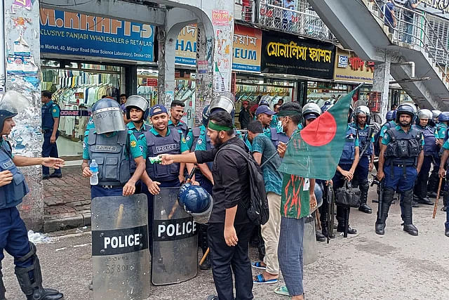 Protestors handing put water and biscuits to police at Science Lab intersection in the capital. 12:30pm Saturday, 3 August 2024