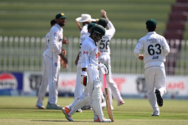 Zakir Hasan walks back to pavilion after his dismissal during the third day of the second test cricket match with Pakistan at the Rawalpindi Cricket Stadium in Pakistan on 1 September, 2024.