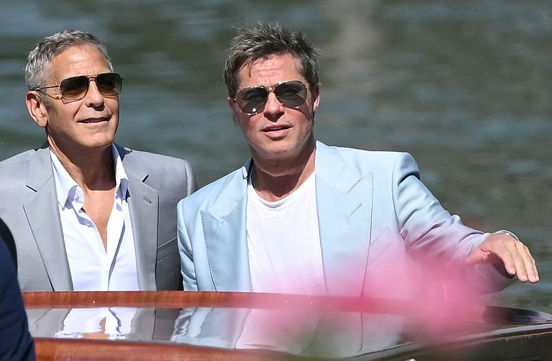 Actors George Clooney (L) and Brad Pitt arrive at the Casino pier during the 81st Venice International Film Festival at Venice Lido, on 1 September, 2024.