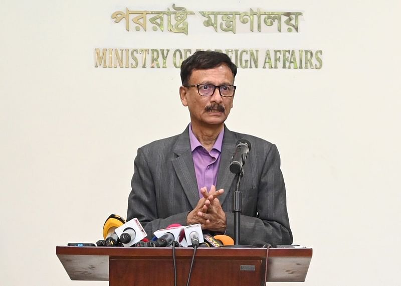 Foreign affairs adviser Touhid Hossain speaks to the media in Dhaka