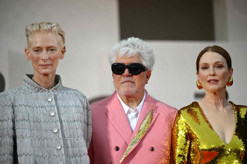 Spanish director Pedro Almodovar, actress Tilda Swinton (L) and actress Julianne Moore attend the red carpet of the movie "The Room Next Door" presented in competition during the 81st International Venice Film Festival at Venice Lido, on 2 September, 2024.