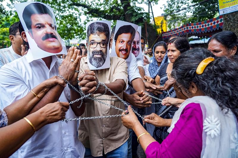 Indian National Congress (INC) party workers wear masks of celebrities from the country's Kerala-based Mollywood film industry during a protest against the government's action over alleged sexual allegations within the industry, in Kochi on 30 August, 2024. Terrified for her safety, Indian actress Sreelekha Mitra remembers pushing chairs and a sofa against her hotel door after she said an award-winning veteran director sexually harassed her.