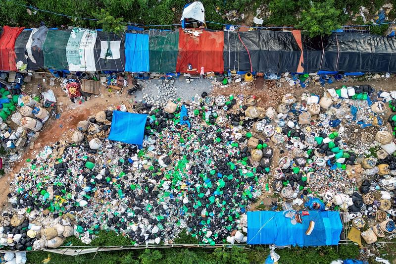 An aerial photograph shows plastic waste gathered from garbage dumps for recycling, at a scrapyard on the outskirts of Bengaluru on 2 September, 2024.