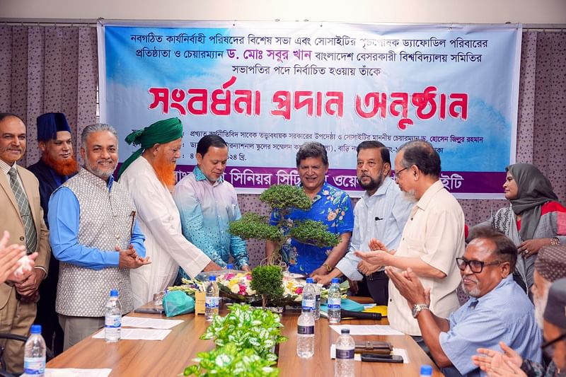 Md Sabur Khan, chairman of the Board of Trustees of Daffodil International University is receiving a memento of reception from former caretaker government Advisor and Bangladesh Senior Citizen Welfare Society chairman Hossain Zillur Rahman at the reception programme accorded to him by Bangladesh Senior Citizen Welfare Society on 4 September 2024.