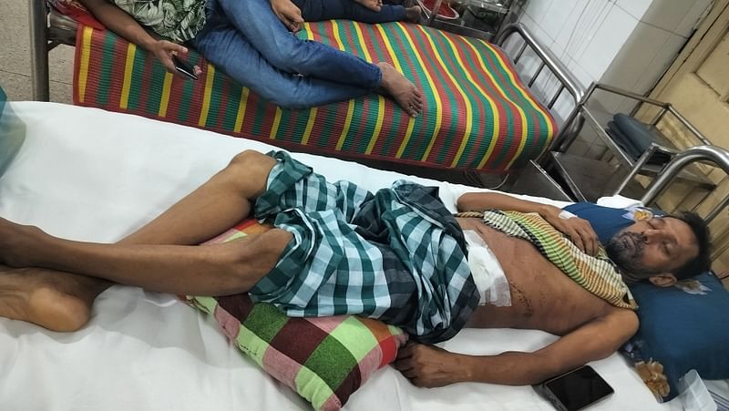 Injured Abdul Latif is lying on a hospital bed