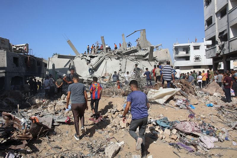 Palestinians search in the rubble for survivors at the site of an Israeli strike in the Shejaiya suburb east of Gaza City on 12 September, 2024, amid the ongoing war between Israel and Palestinian militants