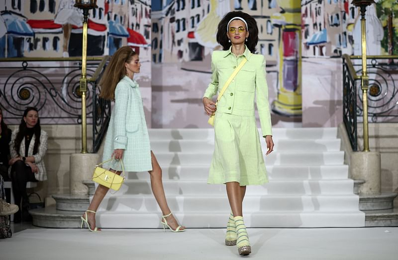 Models present a creation during a catwalk presentation for the Paul Costelloe Spring/Summer 2024 collection, at London Fashion Week in London, on 13 September, 2024.