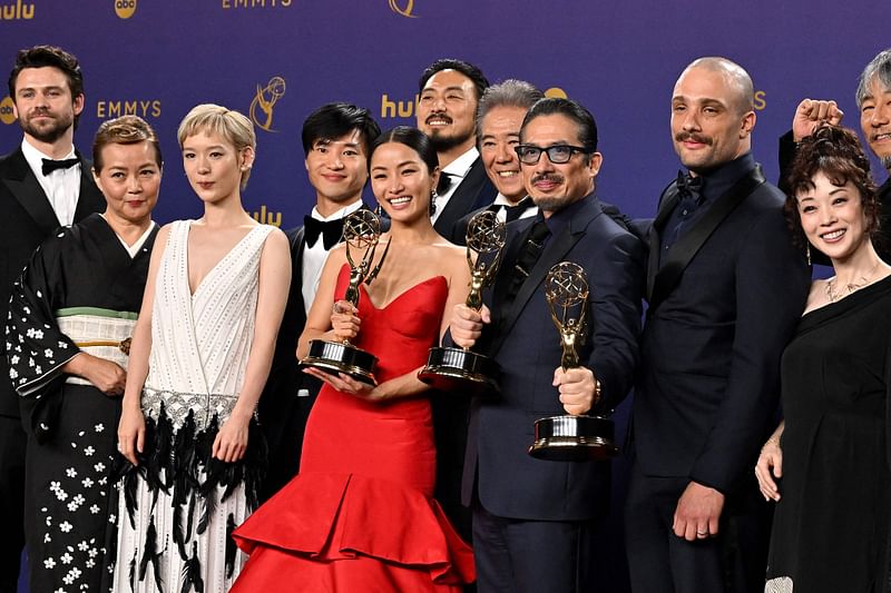 Japanese actor Hiroyuki Sanada (C), alongside cast and crew, winners of Outstanding Drama Series for 'Shogun' pose in the press room during the 76th Emmy Awards at the Peacock Theatre at LA Live in Los Angeles on 15 September, 2024.