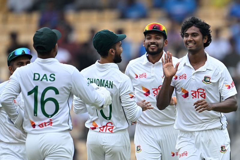 Bangladesh's Hasan Mahmud (R) celebrates with teammates after taking the wicket of India's Shubman Gill during the first day of the first Test cricket match between India and Bangladesh at the M.A. Chidambaram Stadium in Chennai on 19 September, 2024.