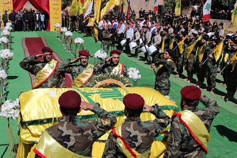 Lebanese Hezbollah members carry the coffin of their killed comrade Hussein Amhaz during his funeral in Baalbek, in Lebanon's Bekaa valley, on 19 September, 2024. Hundreds of pagers and walkie-talkies used by Hezbollah exploded across Lebanon in unprecedented attacks that spanned two days, killing 32 people and wounding more than 3,000 others.