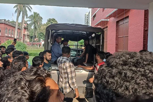 The police, in collaboration with the university administration, detain two students from the Dhaka University campus on 19 September, 2024.