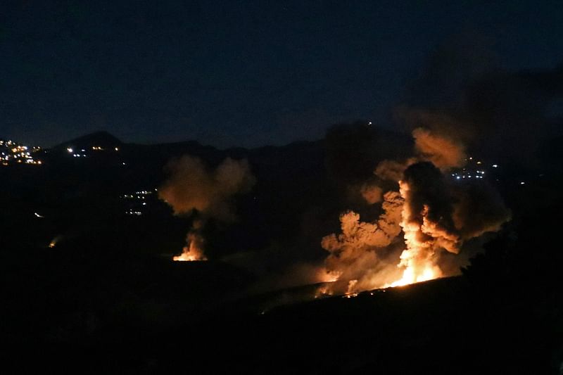 Smoke and fire rise from the site of an Israeli strike on the southern Lebanese border village of Mahmoudiyeh on 19 September, 2024