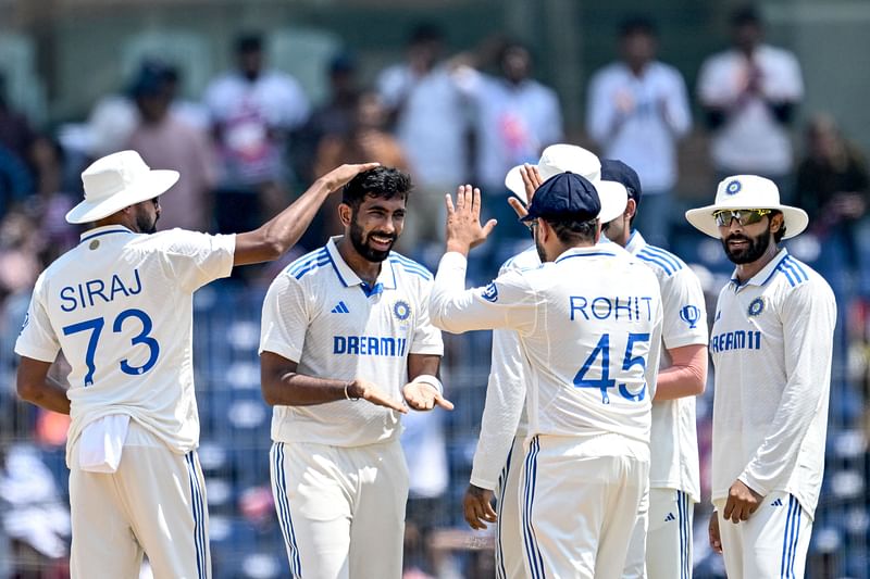 India's Jasprit Bumrah (2L) celebrates with teammates after taking the wicket of Bangladesh's Shadman Islam during the second day of the first Test cricket match between India and Bangladesh at the M.A. Chidambaram Stadium in Chennai on 19 September, 2024.