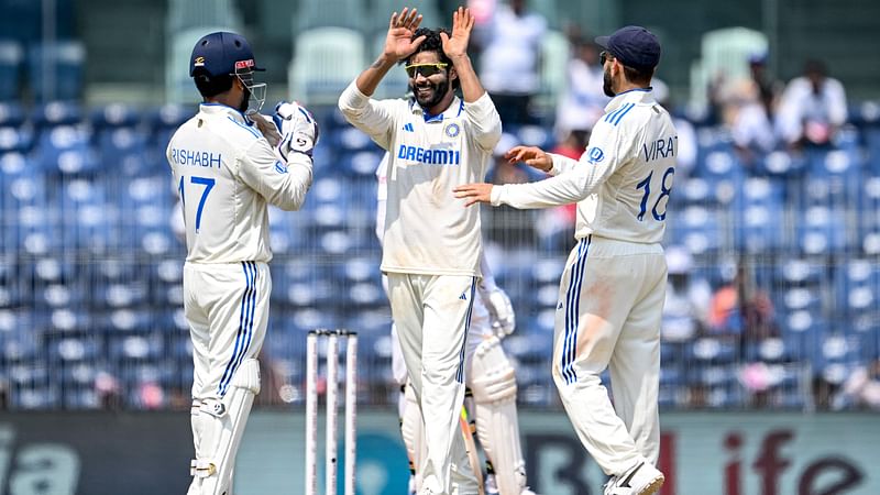 India's Ravindra Jadeja teammates  after taking the wicket of Bangladesh's Shakib Al Hasan during the second day of the first Test