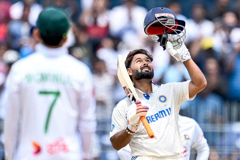 India's Rishabh Pant celebrates after scoring a century (100 runs) during the third day of the first Test cricket match between India and Bangladesh at the MA Chidambaram Stadium in Chennai on 21 September, 2024.