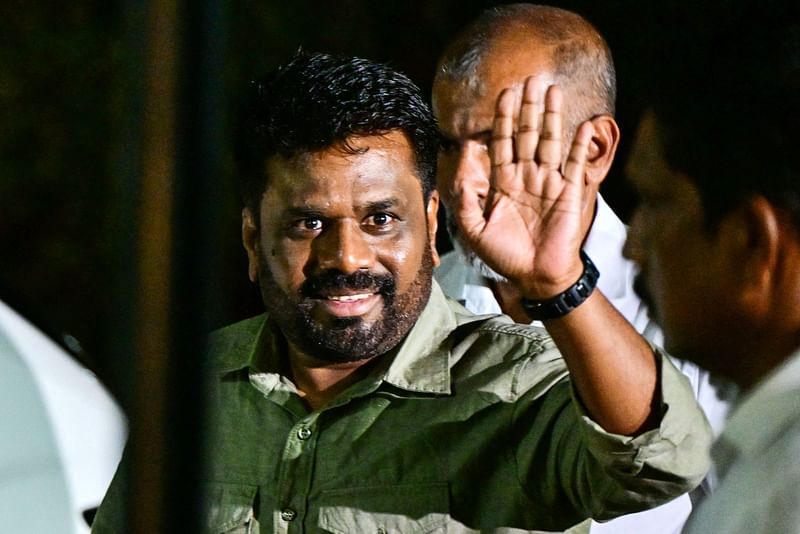 Sri Lanka's president-elect Anura Kumara Dissanayaka, gestures upon his arrival at the Election Commission office in Colombo on September 22, 2024, after his victory in the country's presidential election