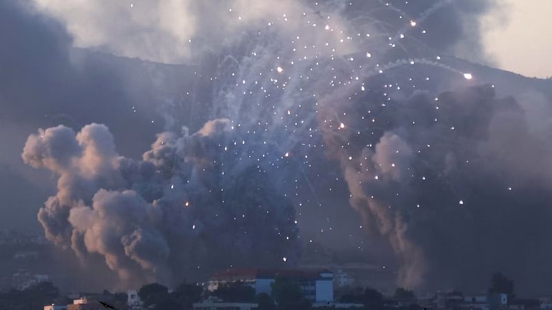 Smoke billows over southern Lebanon following Israeli strikes, amid ongoing cross-border hostilities between Hezbollah and Israeli forces, as seen from Tyre, southern Lebanon 23 September, 2024