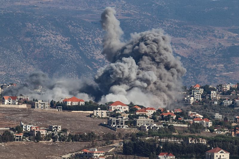 Smoke rises from the site of an Israeli airstrike that targeted the southern Lebanese village of Khiam on 25 September, 2024