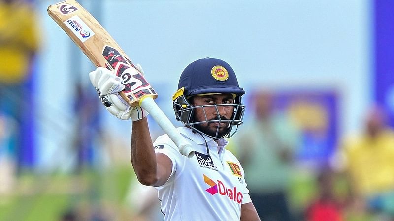 Sri Lanka’s Kamindu Mendis celebrates after scoring 150 runs during the second day of the second Test cricket match between Sri Lanka and New Zealand at the Galle International Cricket Stadium in Galle on 27 September 2024