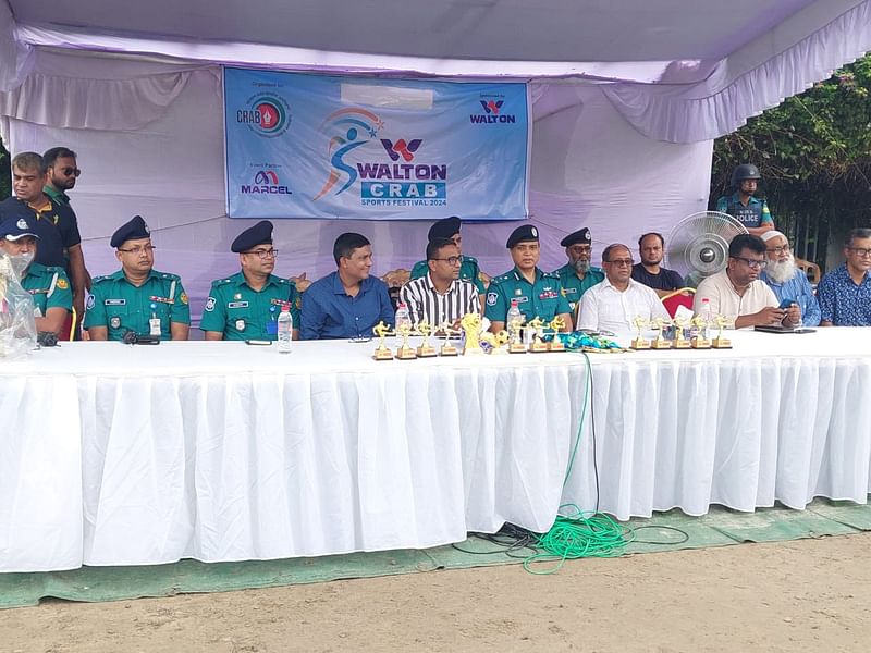 DMP commissioner Md Mainul Hasan responding to a question from reporters at the opening ceremony of the CRAB-Walton Football Festival at Paltan Outer Stadium in Dhaka on Sunday.