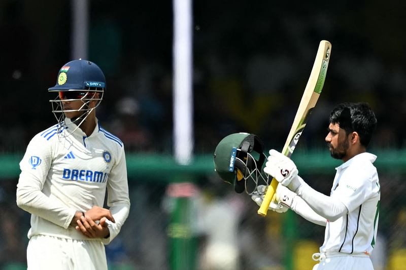 Bangladesh's Mehidy Hasan Miraz (R) plays a shot during the fourth day of the second Test cricket match between India and Bangladesh at the Green Park Cricket Stadium in Kanpur on September 30, 2024