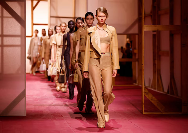 Models present creations by designer Veronique Nichanian as part of her Spring/Summer 2025 Women's ready-to-wear collection show for fashion house Hermes during Paris Fashion Week in Paris, France, 28 September, 2024.