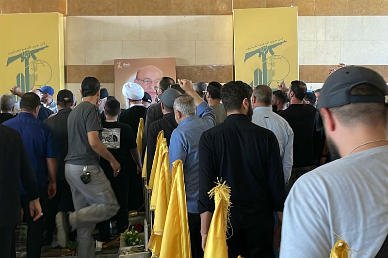 Mourners attend the funeral of slain Hezbollah Commander Ali Karaki, who was killed days earlier with other top commanders in an Israeli air strike, in Beirut’s southern suburbs on 30 September 2024